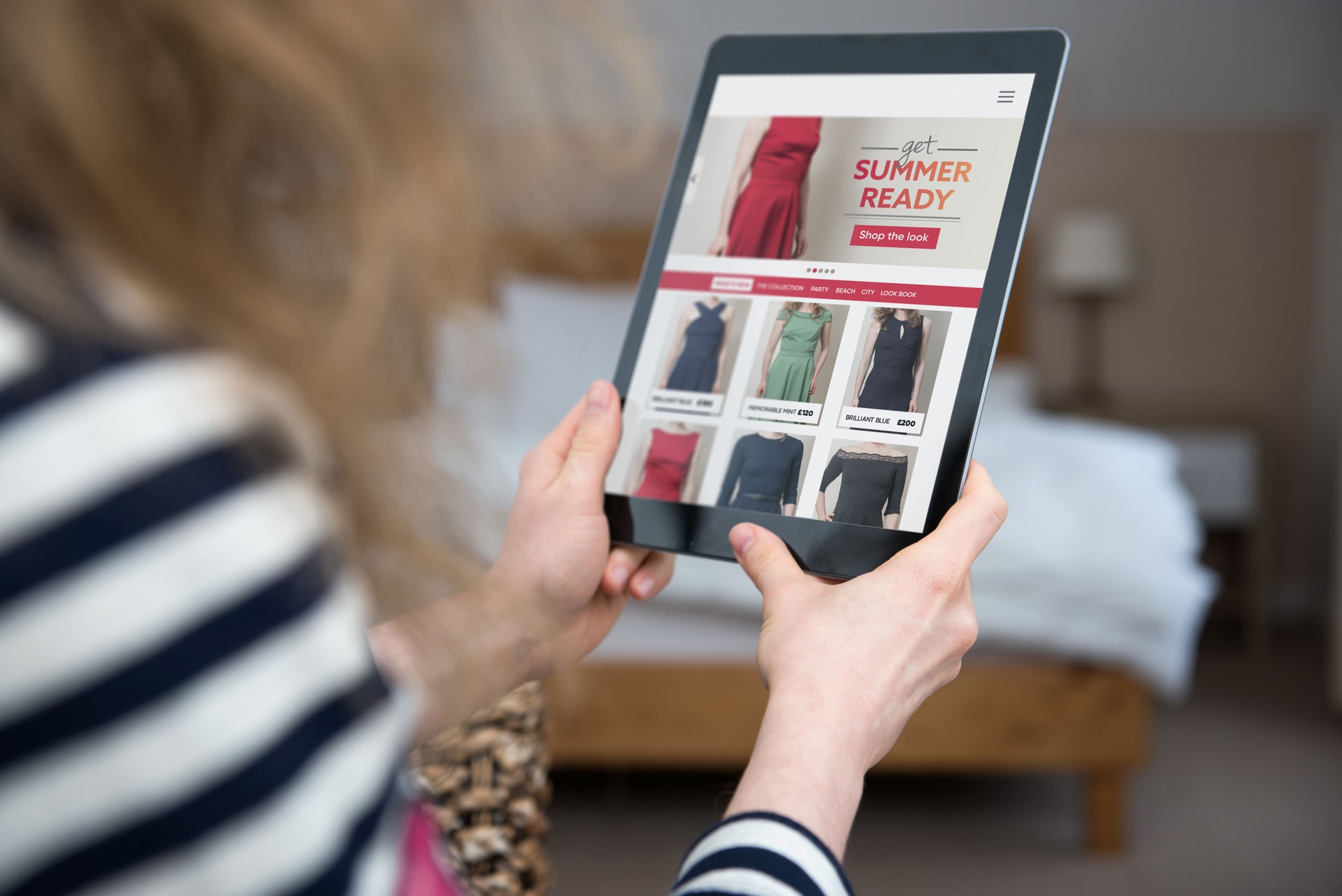 Woman is looking and shopping at website template for fashion online shop.